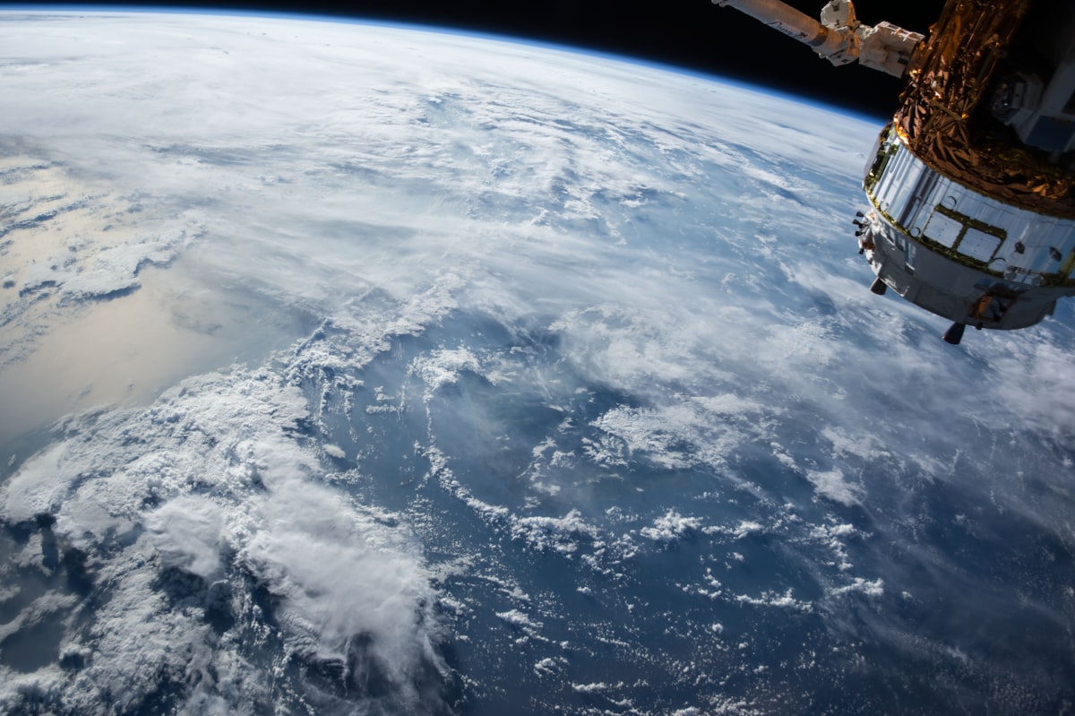 The Earth seen from space with a glowing atmosphere, representing solar activity and space weather