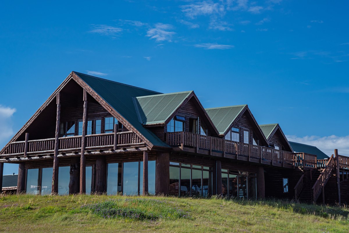 Hotel Rangá's timber lodge on the rise above the plains near Hella, its green metal roofs and log verandas running the length of the building